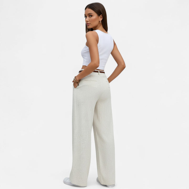 Navacava pleated trousers side view — soft graceful movement