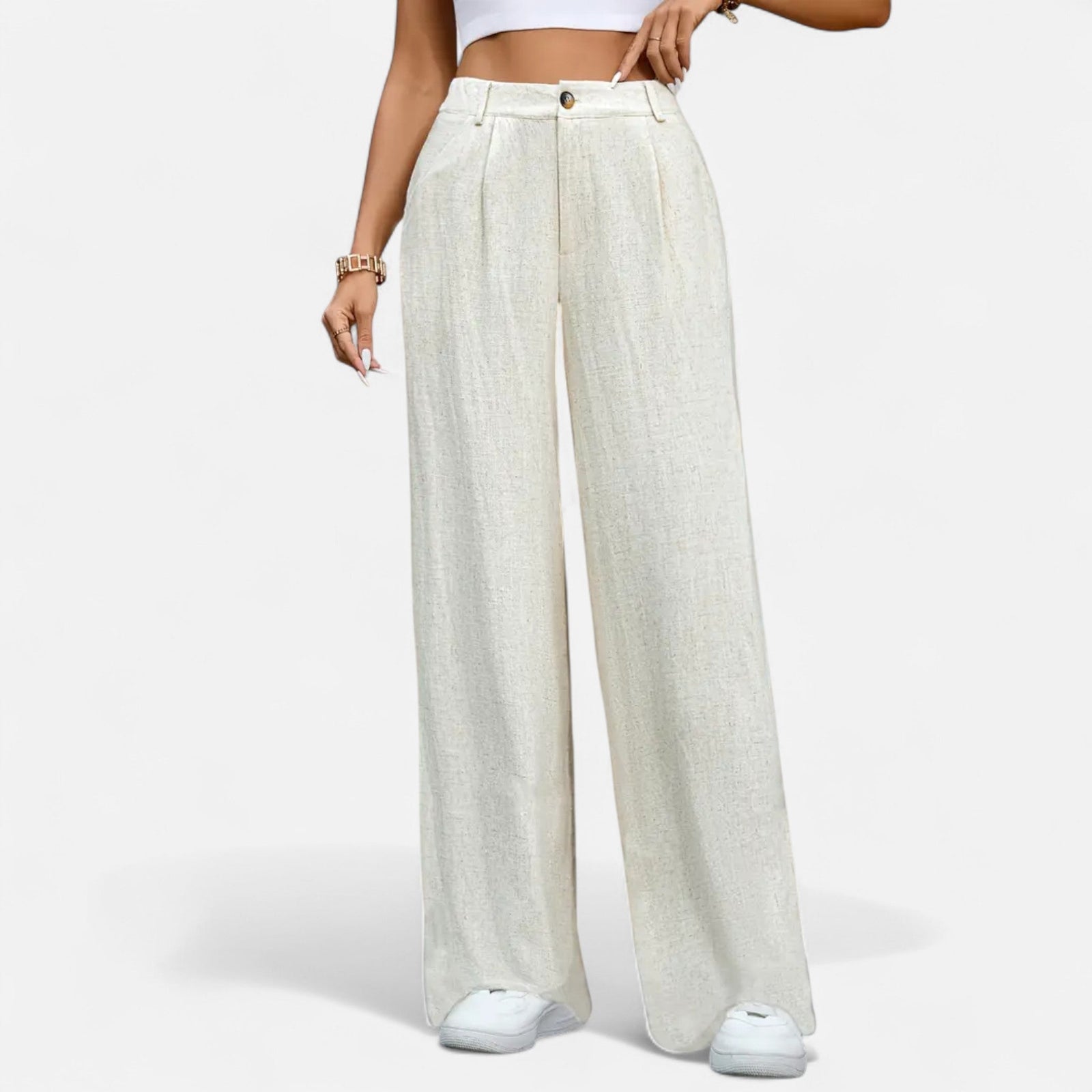 Navacava pleated trousers front detail — high-rise structured silhouette