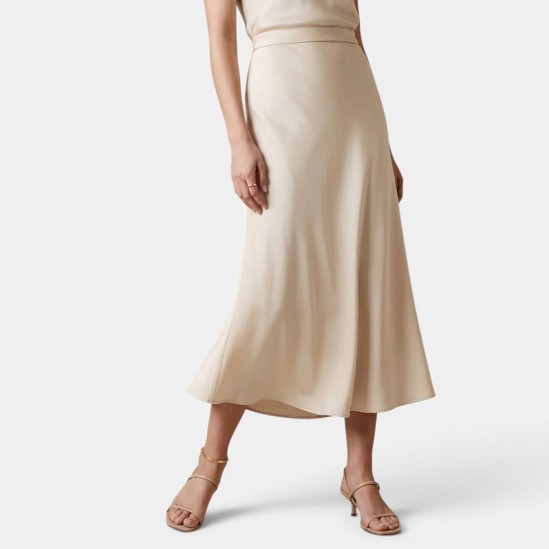 Navacava silk midi skirt back view — natural sheen, flowing drape